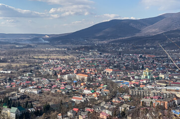 Fototapeta na wymiar Ukrainian town near mountains, landscape in the sunny day.
