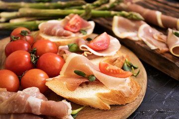jamon sandwich, asparagus on old background