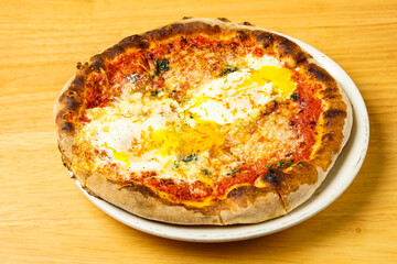 Pizza with sauce and fresh mozzarella cheese