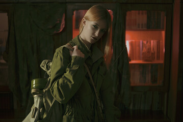 military girl in a gas mask against radiation