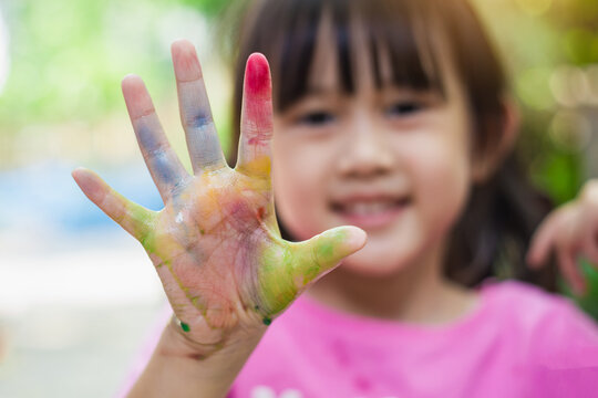 Colorful hands and fingers of kid for finger painting art work. Picture for concept of back to school, art subject and playful in chidren.