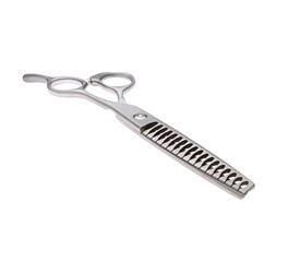 Scissors for cutting people and pets. Grooming scissors. Closed scissors on a white isolated background. Angle view.
