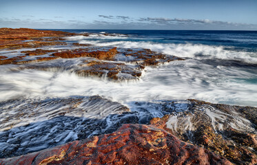 Heavy surf over the rocky coast of Western Australia in Kalbarri National Park
