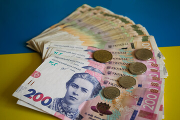 A lot of Ukrainian money (banknotes and coins) - hryvnia, denominations of 1, 2, 5.10, 200 and 500...