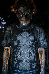 scary sorcerer in smoke. voodoo rite