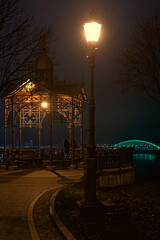 a lantern shines at night in the park of Kyiv