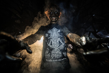 scary sorcerer in smoke. voodoo rite