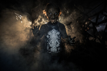 scary sorcerer in smoke. voodoo rite