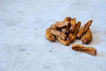 Dried bananas on on a concrete background