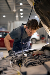 car service, repair, maintenance. caucasian technician checks collect detailed information during...