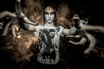 the sorceress stands in the smoke. voodoo rite