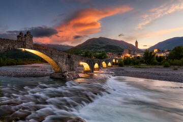 Bobbio and Bridge of Devil at sunset. Emilia Romagna, Italy - obrazy, fototapety, plakaty