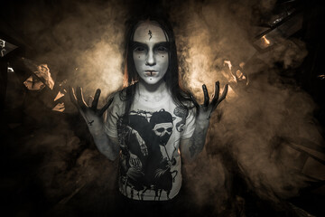 the sorceress stands in the smoke. voodoo rite