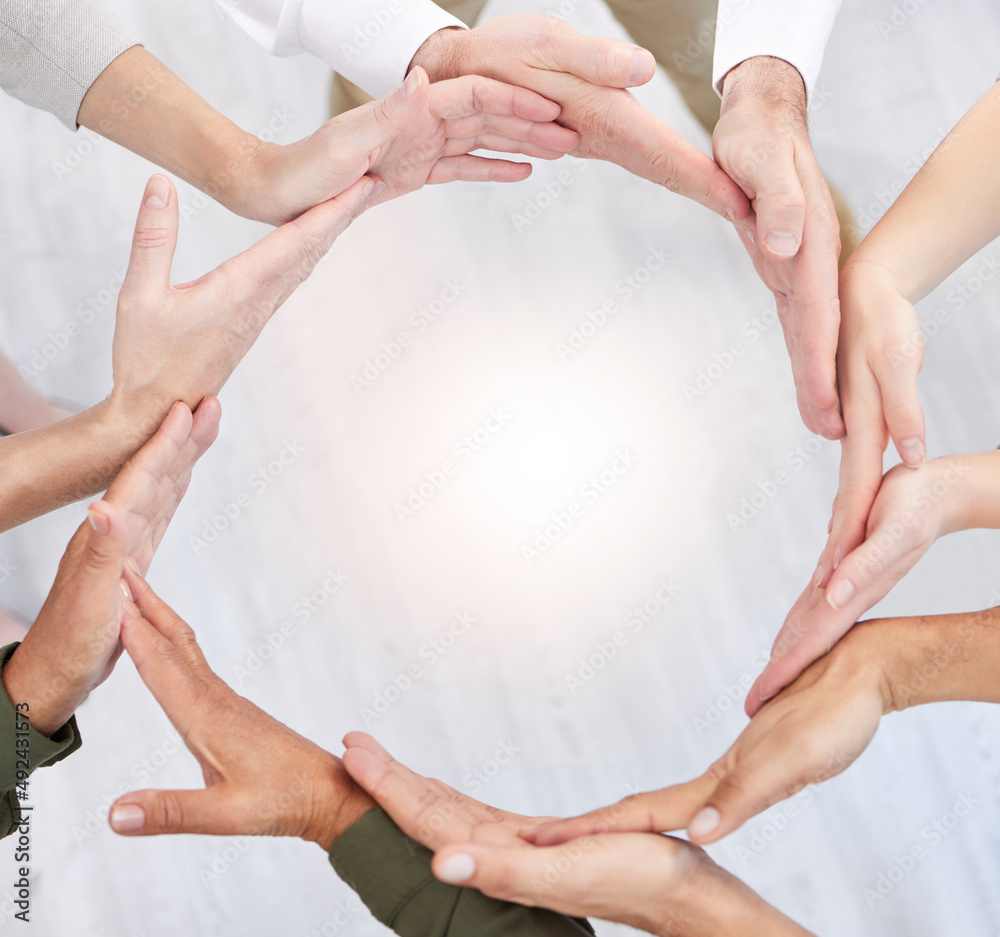 Poster when you think and act like a team. shot of a group of business people with their hands together in 