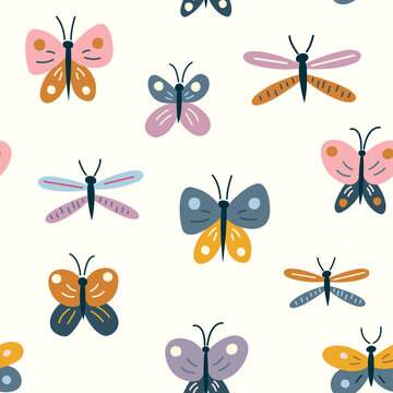 Seamless pattern with a variety of colorful butterflies and dragonflies in random order