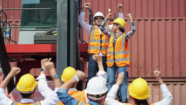 Workers gather to protest and expressed their displeasure at the cargo port with truck and container. Concept of movement, labor strike, work stoppage and revolution.