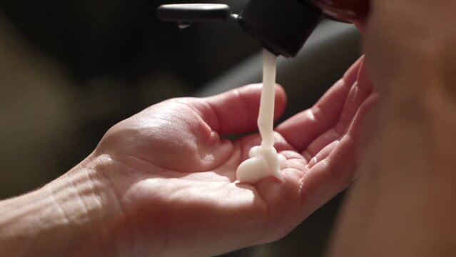 shampoo is poured into the hand. clear liquid