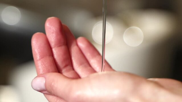 shampoo is poured into the hand. clear liquid