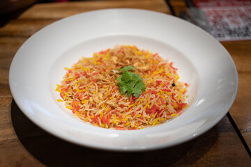 basmati rice mixed with red curry and yellow curry. Dum Handi biryani with gravy with spices. Popular Indian non vegetarian food