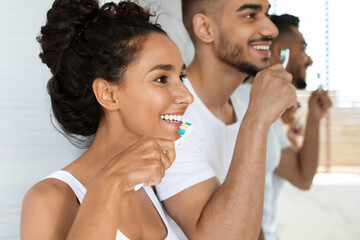 Personal Hygiene. Closeup Shot Of Young Arabic Couple Brushing Teeth Together