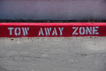 Red curb marked TOW AWAY ZONE