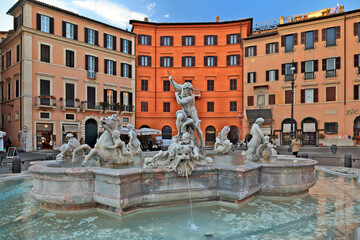 Naklejka premium Fountain of Neptune at Piazza Navona, Rome, Italy. The ancient Greek god Neptune is fighting with an octopus, framed by other sculptures of the mythological theme of the Nereids with Cupids