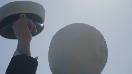 Happy excited students sway graduation hats in the air cheering celebrating graduating school end of semester grown up student happy happiness celebrate hat Swedish memory Nordic dancing future kids - Powered by Adobe