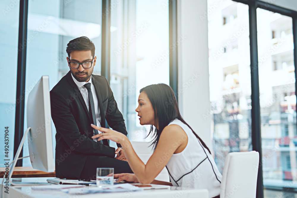 Poster if you look carefully at this.... cropped shot of two young businesspeople having a discussion while