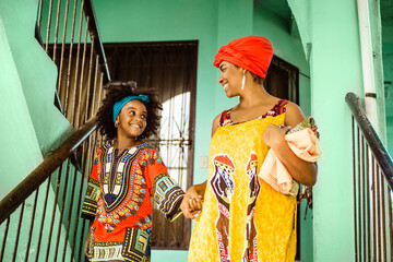 Fototapeta na wymiar black woman mother and daughter together, culture and traditional concept.