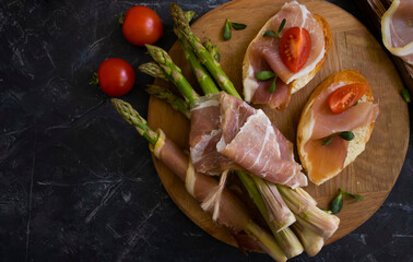 jamon sandwich, asparagus on old background
