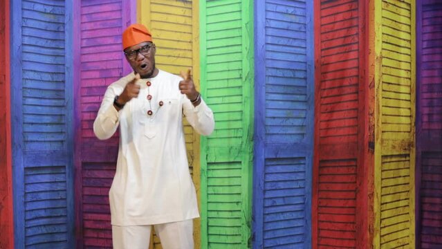 African business man hailing the viewer and offer or imaginary product or service
