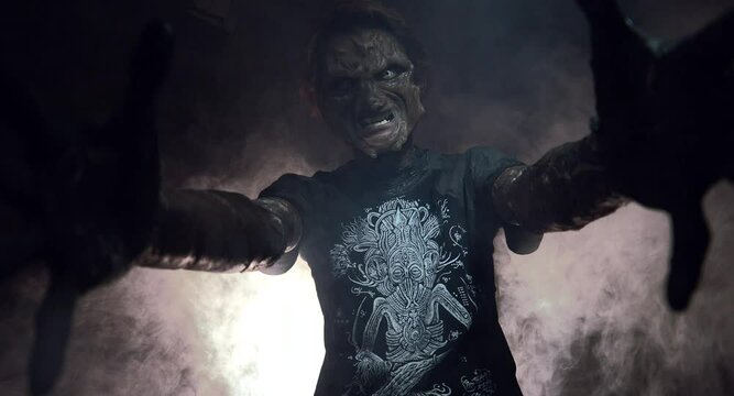 scary sorcerer in smoke. voodoo rite