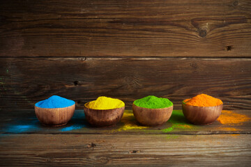 Happy Holi background. Organic colors powder in bowl for Holi festival.