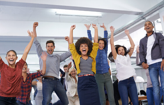 Were all winners. Shot of office staff celebrating a win.