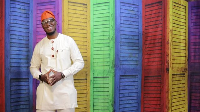 African business man posing and smile at an imaginary product