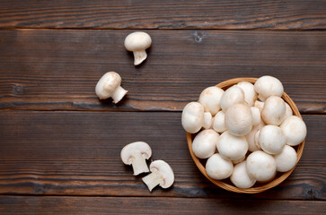 champignons on a wooden background, flat lay, copy space