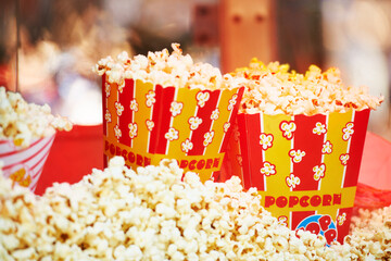 The perfect movie snack. Cropped view of freshly popped corn in packages.