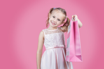 Portrait of positive girl have fun on free time holding colorful bags shopper