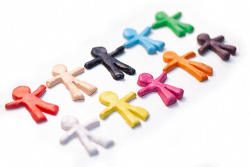 multicolored clay figurines on white background