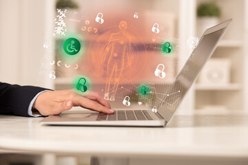 Doctor working on laptop with healthcare concept