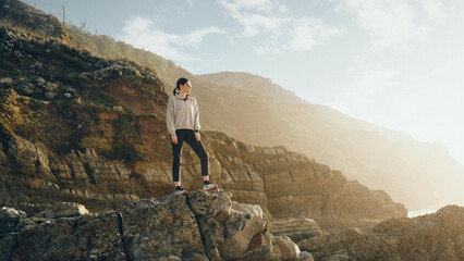 woman on the top of the cliff