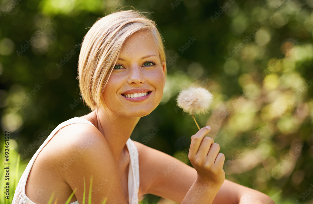 Sticker Fascinated by nature. Shot of an attractive young woman outdoors on a summer day.