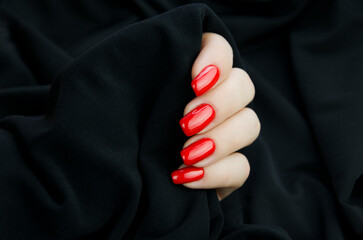 Women's fingers with red manicure