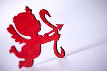 red Cupid shooting  on the white background