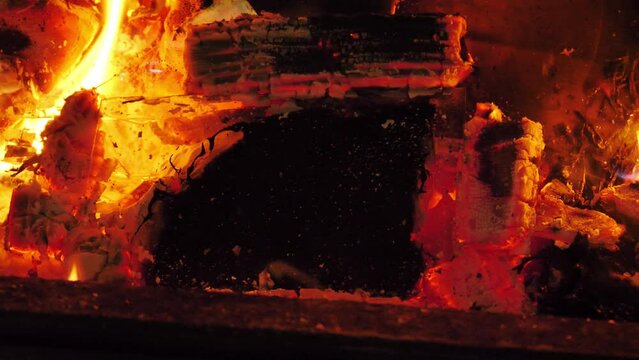 Photo Frame Burned In Fireplace At Night 