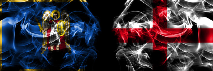 Kyiv, Kiev vs England, English flag. Smoke flags placed side by side isolated on black background.