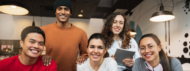 Horizontal banner or header multiracial group of young people looking at camera smiling. Teamwork, students concept.