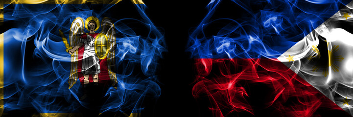 Kyiv, Kiev vs Philipines flag. Smoke flags placed side by side isolated on black background.