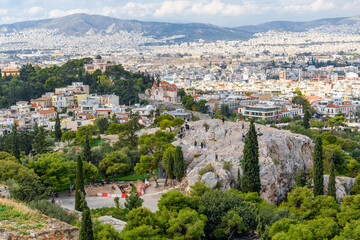 Fototapeta na wymiar View from the Acropolis Hill of Areopagus Hill, a historic site that once served as the high court of appeal for judicial cases in ancient Greece.