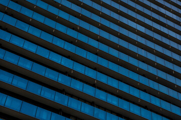 a close-up of a very large apartment building that creates an interesting pattern and ornament,